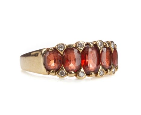 GARNET AND DIAMOND RING,the oval garnets within a border of diamond chips, in nine carat gold, size N 1/2, 3.3g