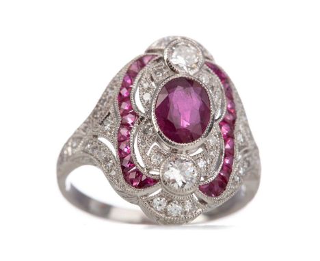 RUBY AND DIAMOND RINGset with central oval ruby and calibre cut rubies totalling approximately 1.17 carats, with round brilli