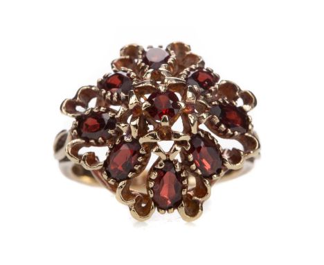 GARNET CLUSTER RING,set with central round garnet surrounded by oval garnets, in nine carat gold, size K, 4.7g