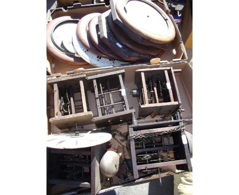 Five late 19th C Postman's alarm wall clock movements and assorted dials, in two boxes. 