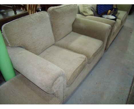 Three piece suite comprising of a two seat sofa, a large two seat sofa and footstool in oatmeal fabric on turned lightwood su