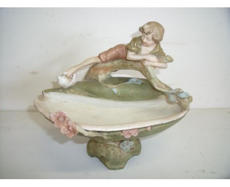 Royal Dux comport figure depicting shell shaped basin with boy playing with cat, the base stamped 1964 (22cm high) 