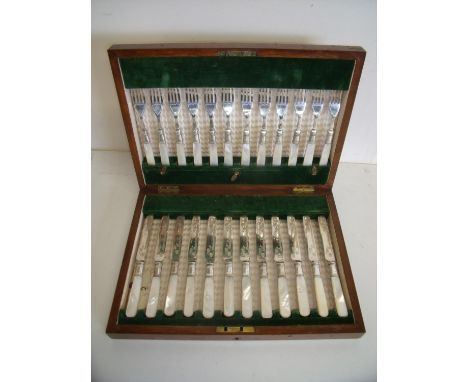 Mahogany cased twelve place silver plated knife & fork set with Mother of Pearl grips 