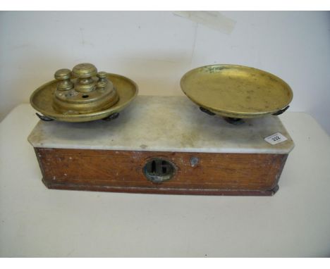 Set of Victorian shop style balance scales with white marble top and a set of associated weights (44cm x 18cm x 18cm) 