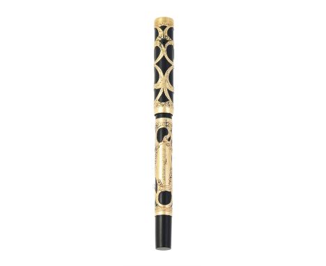 A gold filled fountain pen, circa 1900, the black hardened rubber cap and barrel within a gold filled pierced scrolled overla