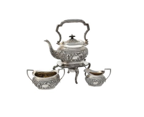 A late Victorian silver oblong baluster four piece tea set, maker's mark JRO, Birmingham 1899, the kettle with a fixed foliat