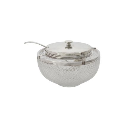 A silver mounted cut glass caviar bowl by Asprey & Co. Ltd., Birmingham 1915, with a flat circular finial to the slightly dom