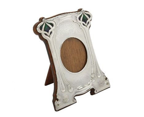 An Art Nouveau silver mounted and enamel shaped rectangular photo frame by William Hutton & Sons Ltd., date letter rubbed, ci