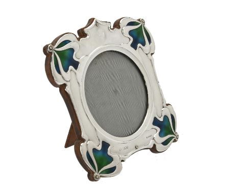 An Art Nouveau silver mounted and enamel shaped square photo frame by William Hutton & Sons Ltd., London 1902, 18cm (7in) hig