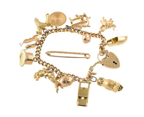 A vintage curb link charm bracelet, the bracelet suspending various 9 carat gold charms including, an owl, an egg, a magician