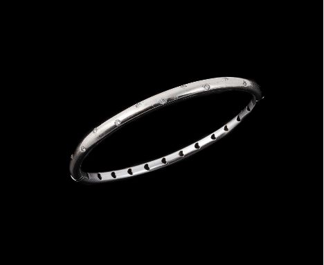A diamond set hinged bangle, the tubular bangle with brilliant cut diamond accents, approximately 0.25 carats total, the conc