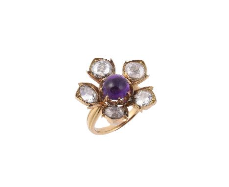A diamond and amethyst flower head cluster ring, the central circular cabochon amethyst within a surround of old cut diamonds