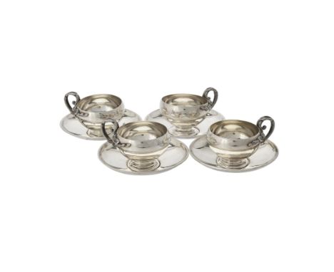 A set of four French silver cups and saucers, circa 1900, .800 standard, import mark, the cups with foliate loop handles and 