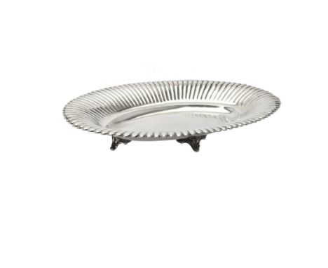 A silver coloured shaped oval dish, stamped Habis, with a lobed border and on four foliate bracket feet, 50cm (19 3/4in) long