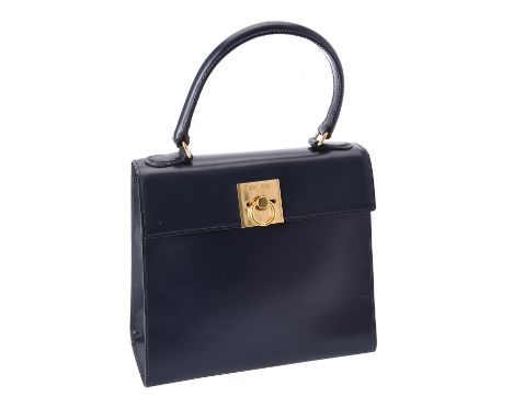 Celine, a blue leather handbag, blue leather bag with a single handle, the flap with a yellow hardware flip clasp, the red le