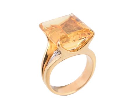 A citrine dress ring by H. Stern, the step cut citrine with canted corners, set above a star shaped panel set with a single s