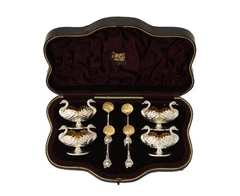 A cased set of four silver swan salts and spoons by Hilliard & Thomson, the salts Birmingham 1890 and the spoons Birmingham 1