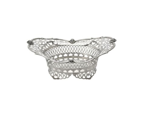 An Edwardian silver shaped oval pierced bowl by Sibray, Hall & Co. Ltd., London 1902, with a scroll and mask border, pierced 