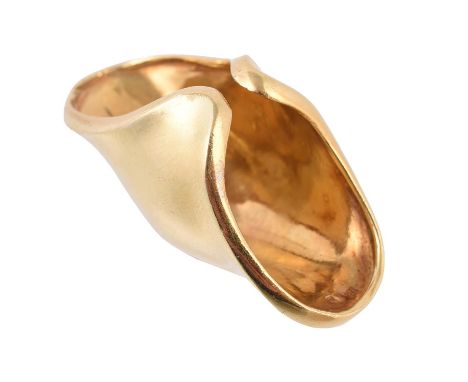 A gold coloured domed dress ring, the panel shaped to fit over a knuckle, stamped 18k RLM, finger size approximately M-N, 25g