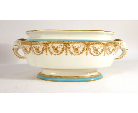 A Royal Worcester tureen of oval form having a pair of elephant head handles and decorated in the neo-classical manner on a w