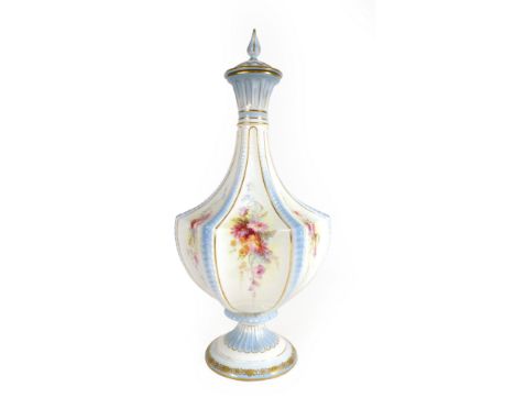 A Royal Worcester decanter and stopper of slender hexagonal form, the panels each decorated with a floral spray on a white gr