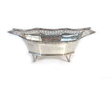 An early 20th century silver bon bon dish of elongated octagonal form having shell decoration within a pierced border on four