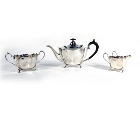 A silver three piece tea service of boat shaped form on outswept feet, George Gordon & Son, Sheffield 1924, 34 ozs, together 