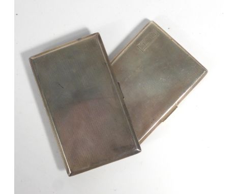 A silver engine turned cigarette case, maker FC, Birmingham 1936, l. 12.5 cm, together with a similar case, overall 13 ozs (2