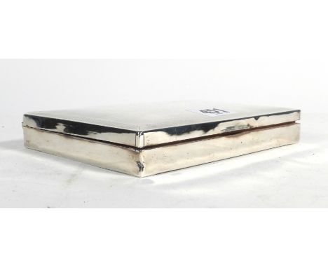 A silver engine turned cigarette case of plain rectangular form, hallmarks badly rubbed, w. 16.5 cm   CONDITION REPORT:  Badl