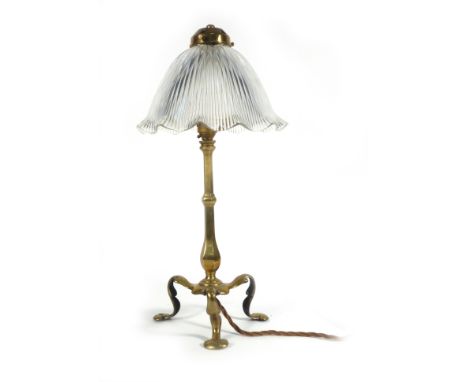 An Arts & Crafts brass table lamp with a glass shade in the manner of W.A.S. Benson, h. 47 cm   CONDITION REPORT:  Lamp in fa