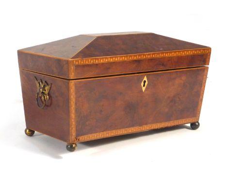 A 19th century walnut, inlaid and strung tea caddy of sarcophagus form on bun feet, w. 30 cm   CONDITION REPORT:  One foot lo