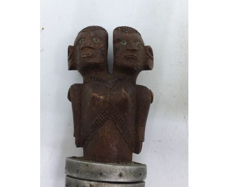 An African carved wood stick. H:38cm