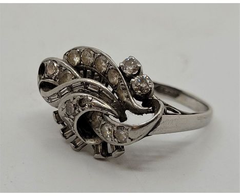 A platinum diamond dress ring,&nbsp;c.1930's, pave set graduated round brilliant cut and channel set baguette cut diamonds (o