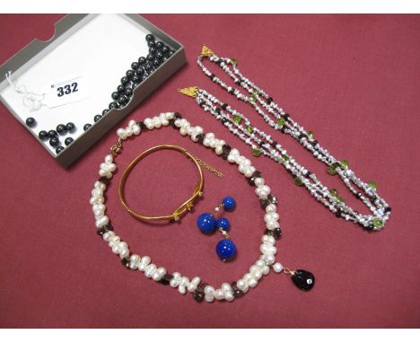 A Ruby and Diamond Set Bangle, hinged to snap clasp (damaged), together with modern fresh water pearl bead necklaces, etc. 