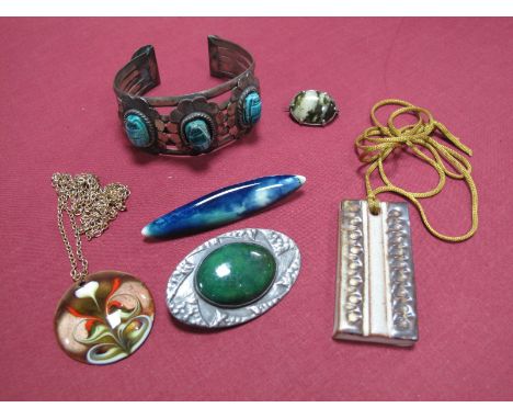 Ruskin; A Ceramic Bar Brooch, mottled blue and green, with applied brooch fitting (partly obscuring stamped mark "RUSKIN"), t