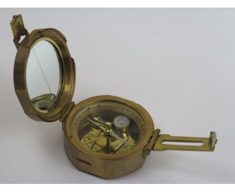 A Nauticalian Brass Compass, c. 8cm diam. 
