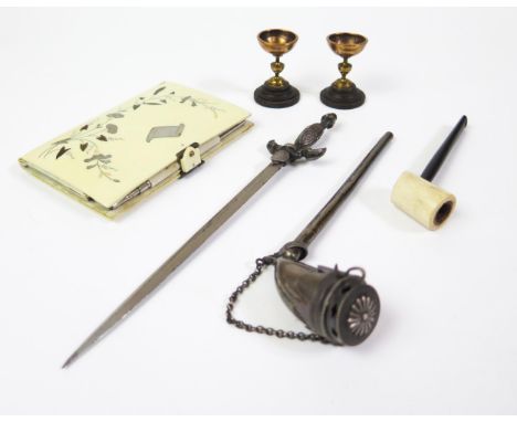 A Faux Ivory Celluloid and Inlaid Aide Memoir, silver pipe, Mont St. Michel sword penkife and a pair of miniature cups made f