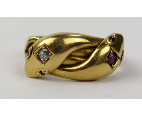 An Antique 18ct Gold, Ruby and Diamond Twin Head Snake Ring, ruby c. 3mm and diamond c. 3 x 2.7mm and with further diamonds t