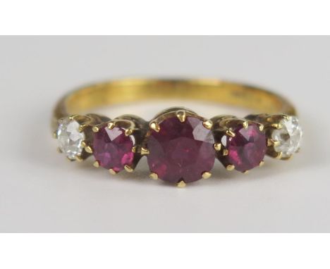 An 18ct Gold, Ruby and Diamond Five Stone Ring, central c. 5.3mm stone flanked by two c. 3.5mm and with two c. 3.1mm diamonds
