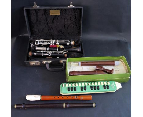 A Boosey &amp; Hawkes Regent Clarinet cased, Hohner Melodica Soprano, Dolmetsch Recorder boxed, Hohner recorder and flute 