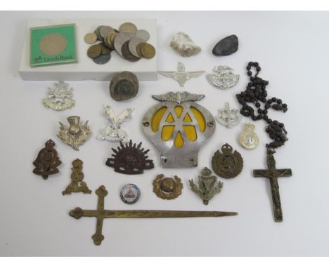 An Australian Commonwealth Forces Cap Badge, George VI Royal Engineers cap badge, Connaught Rangers cap badge, Royal Army Ord