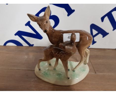 A WESTERN GERMANY CERAMIC GROUP OF A DEER AND FAWN NO 771