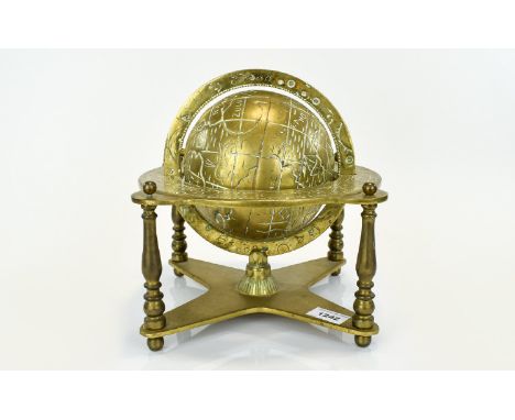 A Vintage Solid Brass Globe Decorative globe with zodiac engraved equator ring and x frame base. Good condition, 10 inches hi