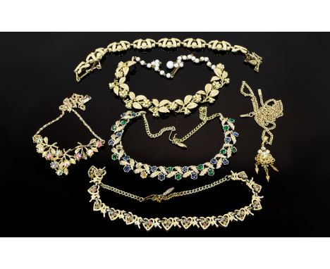 A Collection Of Vintage Costume Jewellery Six necklaces in total, to include two cream enamel and gold tone 1950's collar nec