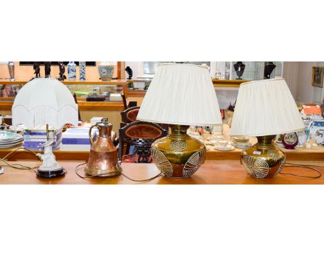 A Pair Of Ornamental Brass Lamps Squat, spherical lamps in brass with impressed floral oriental pattern and cream pintuck sha