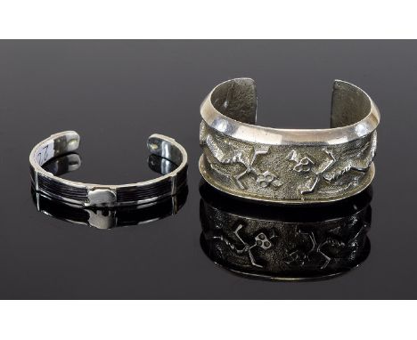 Silver African Inspired Cuff And Silver Tone Statement Cuff Two items in total, the first a slim silver cuff with inset black