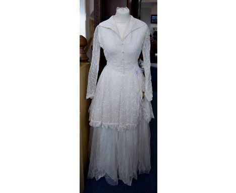 Vintage Wedding Dress An ivory wedding dress in the romantic revival style. Fashioned from layered tulle and foliate design m