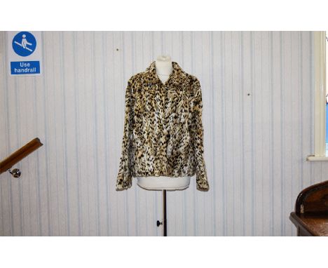 Ocelot Jacket Vintage short boxy fur jacket with small, velvet backed round collar, front patch pockets, hook and eye closure