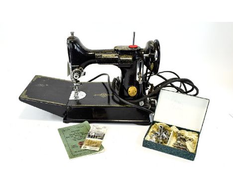 Antique Singer Portable Electric Sewing Machine Model 221K1 Rotary Hook Reverse Feed Finished in traditional black and gold, 