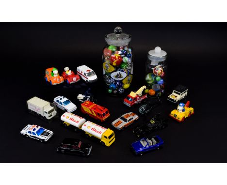 A Collection Of Playworn Cars And A Variety Of Glass Marbles Comprising two traditional sweet jars filled with numerous marbl